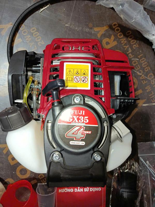Đầu máy cắt cỏ gx35 dùng để máy bơm nước , chế bình phun thuóc