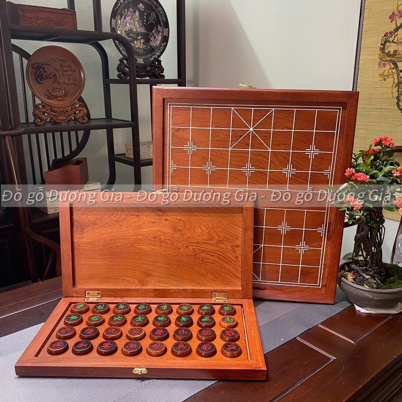 Bàn cờ tướng bàn cờ gỗ hương cao cấp gập gọn cất quân cờ bên trong.