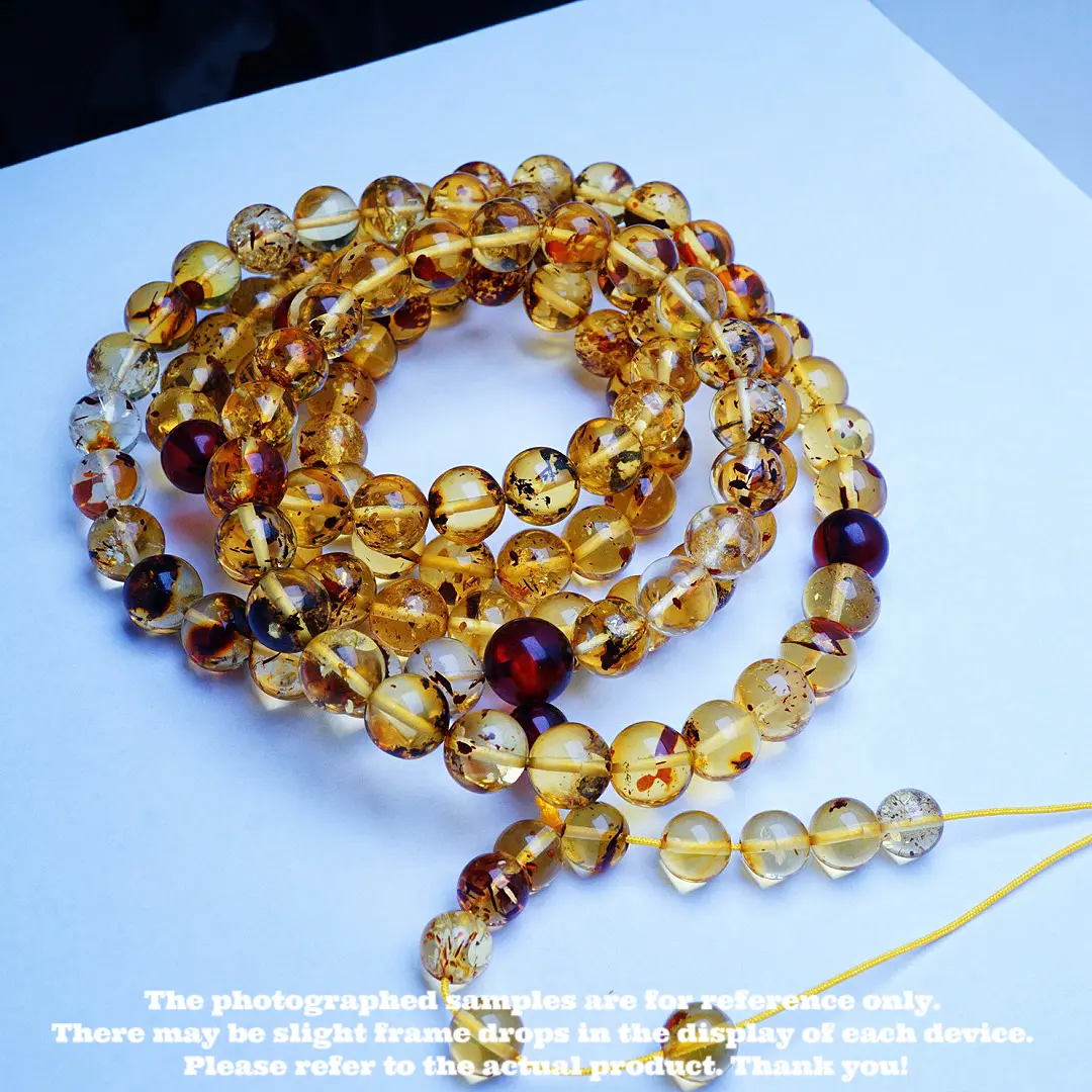 Natural flower - pattern inclusions amber and beeswax round - bead necklace