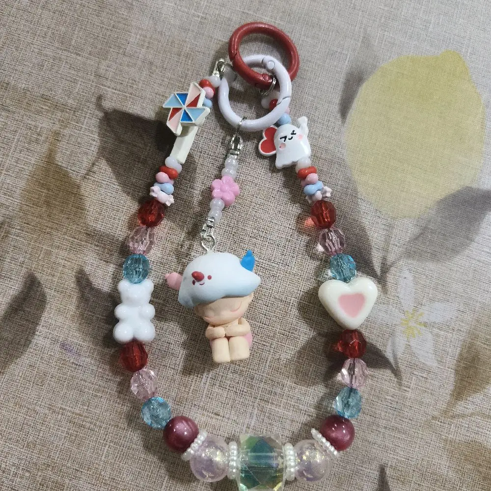 hi all this is a handmade keychain. the character name is called dimoo devil