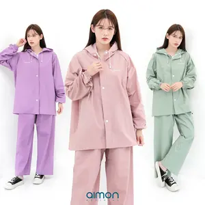 Aimon Jas Hujan Unisex Warna Pastel Setelan Jaket & Celana Tebal Waterproof Parasut PVC 0.25 Elastis dengan Karet Selangkang dan Sablon Logo Menyala Ukuran L XL XXL