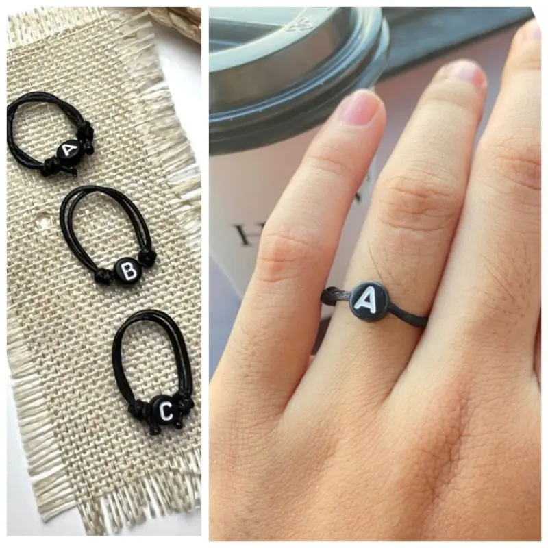 CINCIN INISIAL HURUF BULAT/BUNDAR HITAM TULISAN PUTIH TALI KOREA 1 MM (XSEMPLAR)