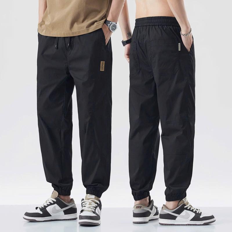 Quần Mác Thêu Joger Nam Kaki Gió Giãn Cao Cấp Loại Mềm Co Dãn Thấm Hút Mồ Hôi Không Bai Xù Phong Cách Thể Thao Cho Nam - Chuẩn Form - Chuẩn Dáng Jogger