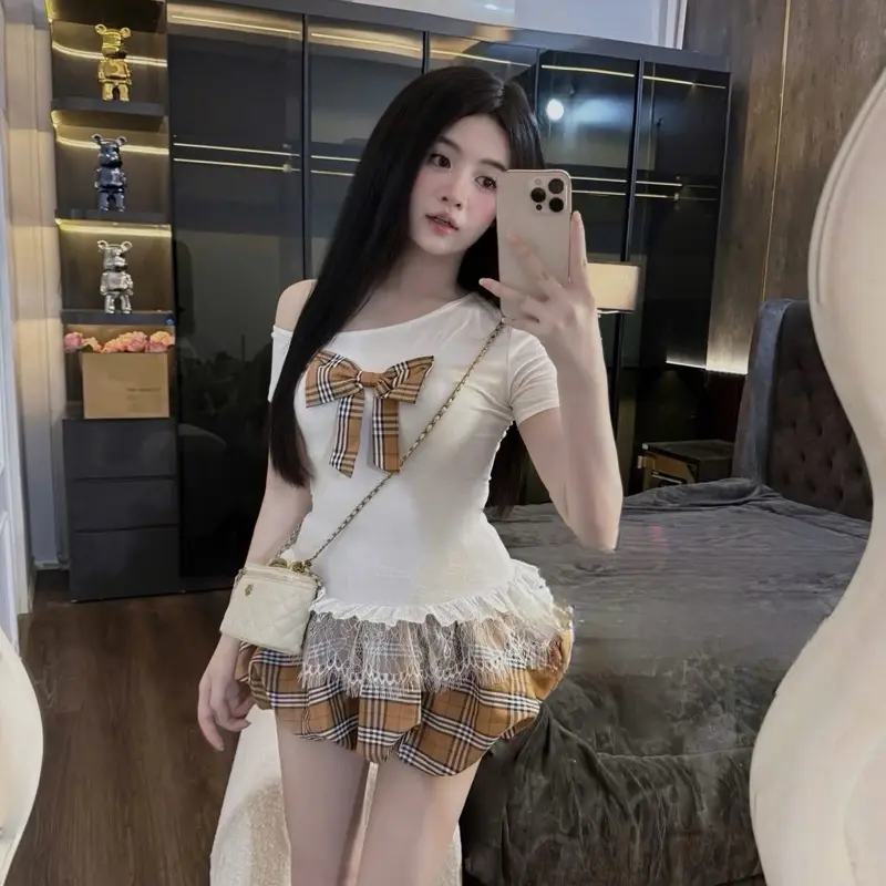 Set áo lệch vai đính nơ phối ren mix chân váy bồng có quần bo chun 2 màu trắng, đen hàng L1
