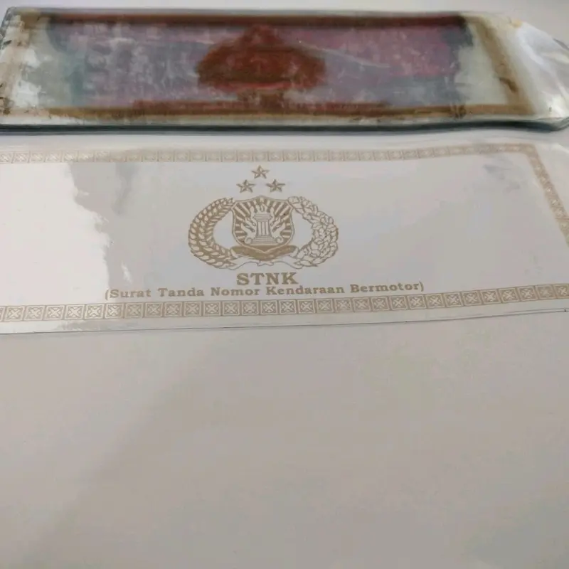 plastik sntk (isi 2lembar) cover pembungkus stnk logo warna gold 1