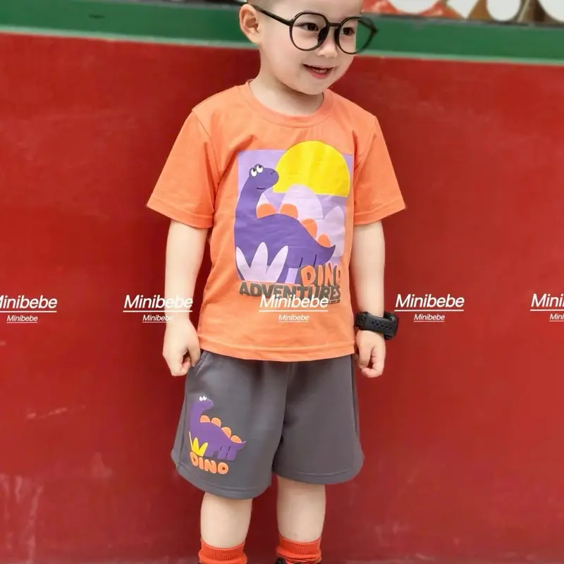 Bộ đùi bé trai(GIÁ MỞ BÁN)Bộ cộc tay in hình khủng long chất liệu cotton, áo màu cam quần ghi cho bé từ 9 đến 28kg