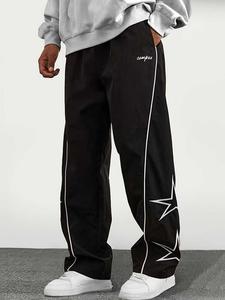 Pantalones casuales de hombre de corte holgado con rayas y retazos, cómodos de estilo occidental para actividades al aire libre, pantalones a la moda y modernos