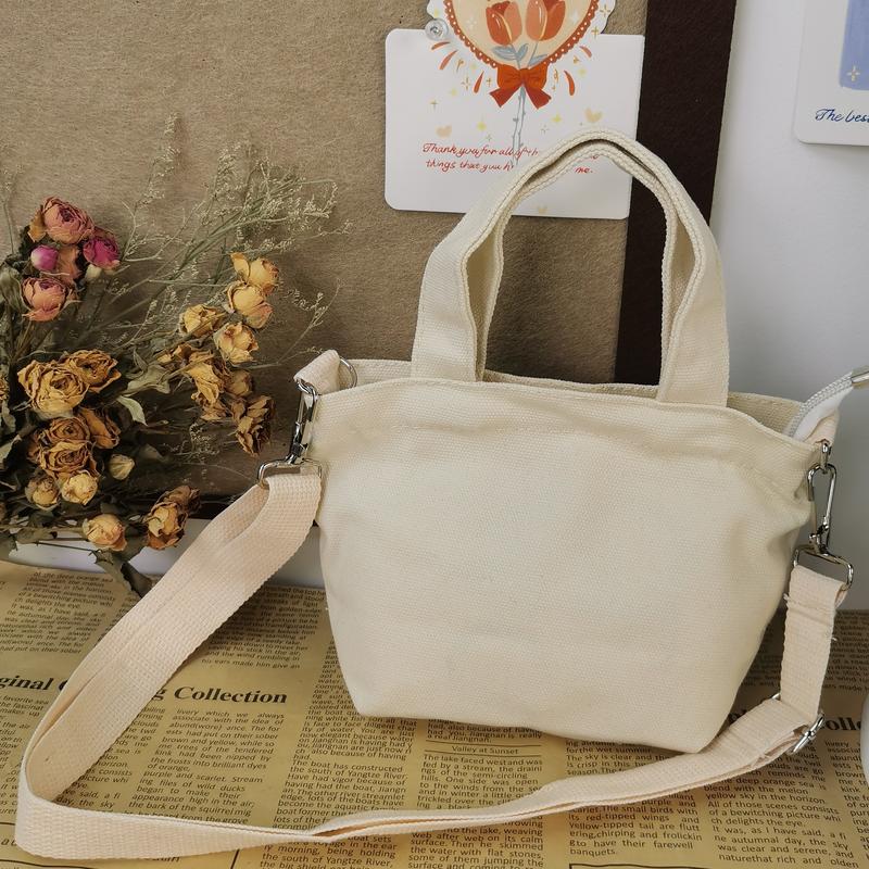 Product Introduction of GENTLEWOMAN Soft women sling bag, Thai cute cat design, zipper closure, 2 colors available (white and black), made of canvas, suitable for women 4