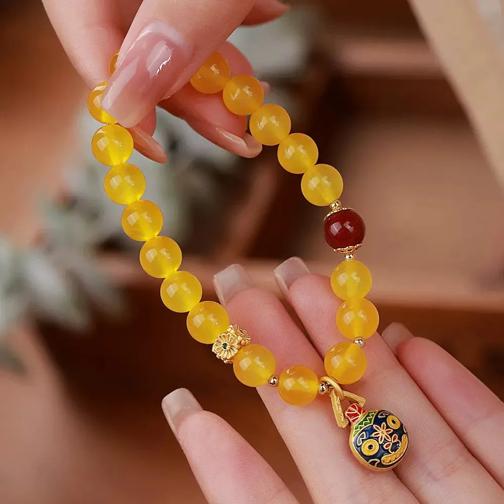 Natural stone yellow agate bead bracelet with the "Hunjin" beast pattern on the surface, and South Red agate beads.