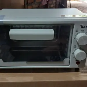 Tixx Oven Listrik 15L 300W Multifungsi Hemat Daya Pemanas Merata Anti Gosong Timer Dan Suhu Kontrol Praktis Untuk Panggang Kue Pizza Roti Ayam Ikan Cocok Dapur Rumah Kecil Alat Masak Elektronik Serbaguna Awet Mudah Digunakan Terlaris Harga Terjangkau
