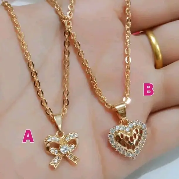 perhiasan fashion wanita kalung titanium nuri motif pita dan love te4baru 2024 Emas 0