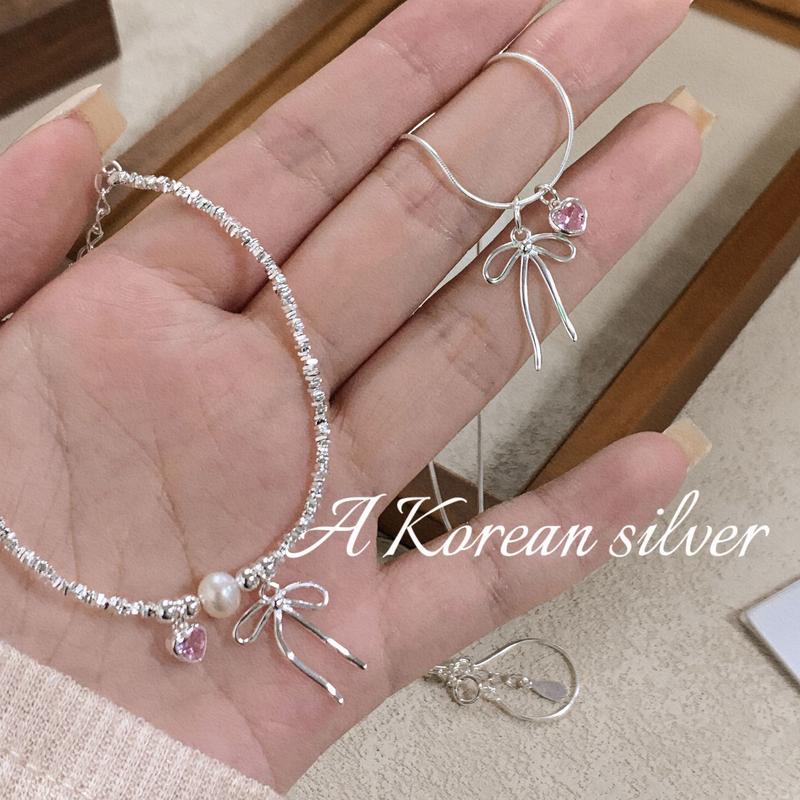 Bộ Dây Chuyền Và Vòng Tay Cho Nữ,Vòng Cổ Thiết Kế Tinh Tế Với Nơ Và Trái Tim, Ngọt Ngào Và Dễ Thương, Được Làm Bằng Vật Liệu Thép Titan Không Bị Gỉ Hoặc Phai Màu, Thích Hợp Làm Quà Sinh Nhật Cho Bé Gái Có sẵn trong gói, bộ hai mảnh