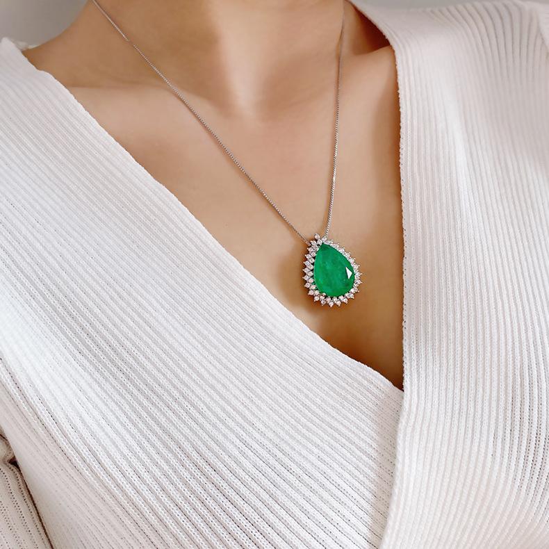 Product Introduction of Micro Inlaid Paraiba Water Drop Gem Necklace Female Ocean Heart Pendant Long Sweater Chain Female 8