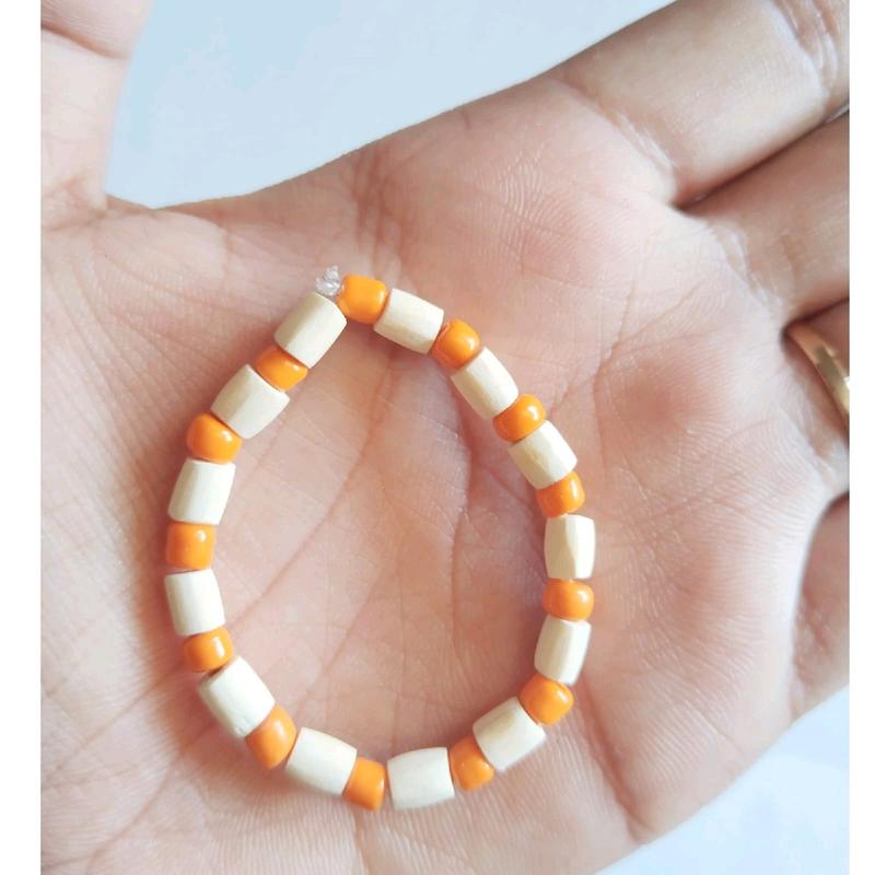 GELANG OTOK BAYI ATAU GELANG SAWAN BAYI MUTIARA WARNA OREN 0