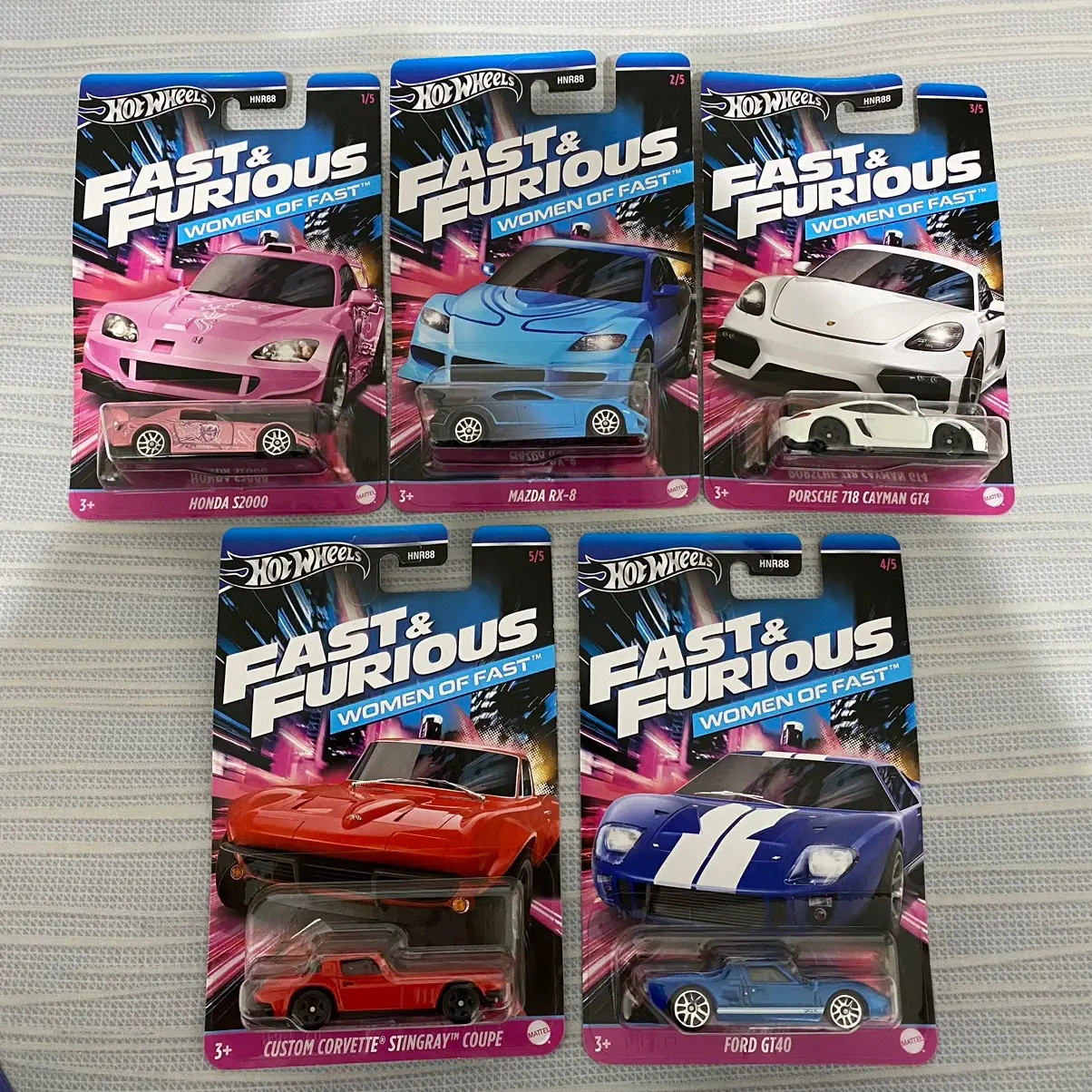 ￼Hot Wheels Fast and Furious Women of Fast (Honda S2000 Pink, Porsche Cayman GT4, Mazda RX8, Ford GT40, Custom Corvette Stingray Coupe)