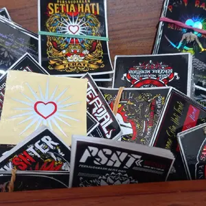 Stiker PSHT biasa dan hologram, atau cuttingan