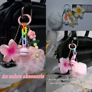 Bag charm gantungan tas bandul jepitan bunga kamboja dan pompom 5cm berlonceng ukuran bunga kamboja 4cm