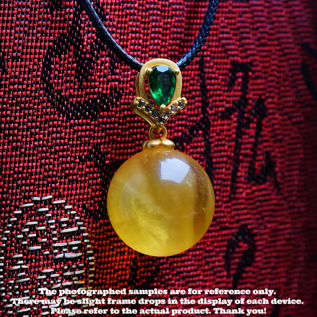 Amber and beeswax round bead pendant