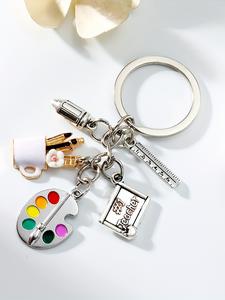 Llavero de tablero artístico de aleación en color plateado con regla, pincel y portabolígrafo, regalo de arte escolar, diseño adorable de personaje de dibujos animados
