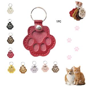 犬の毛を収納したキーチェーン、かわいいレザー肉球キーチェーンペット毛記念品、ユニークなメモリアルコレクションキーチェーン、ペットメモリアルギフト用バッグパース肉球チャームキーホルダー
