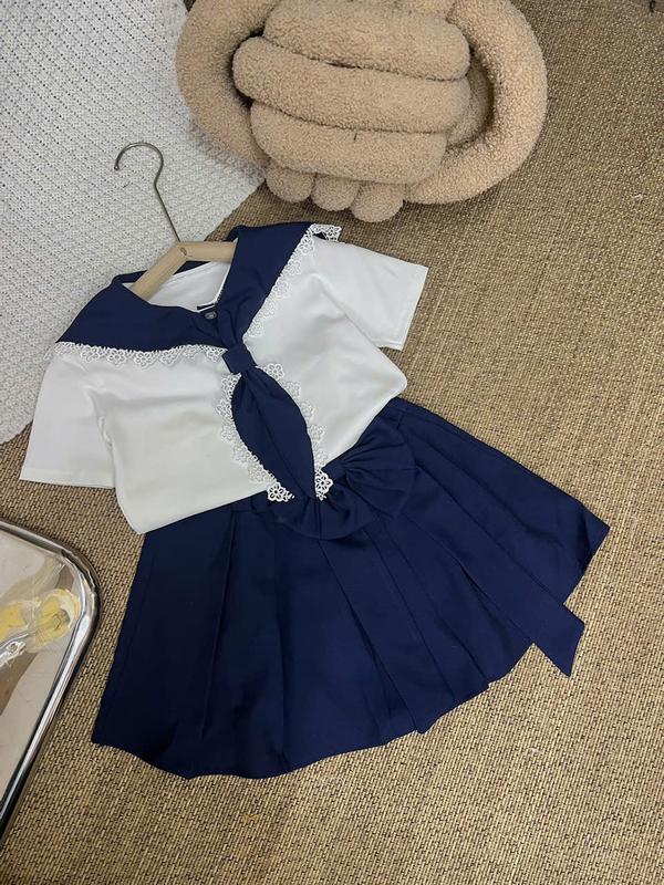Set Áo Thun Trắng Cổ Thủy Thủ Xanh Đen Viền Ren Kèm Chân Váy Xanh Đen Nơ Dài 61M Dành Cho Bé Gái
