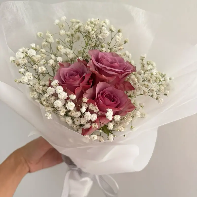 Purple rose with baby breaths