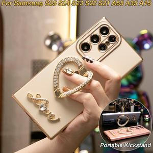 เคสโทรศัพท์, ที่วางขาตั้งหัวใจ Rhinestone สุดหรู, ชุบ, ตัวป้องกันกล้องแบบนิ่ม, สำหรับ Samsung S25FE, S25Edge, S25Ultra, S25+, S25, S24, S23, S22, S21, A17, A16, A15, A26, A25, A36, A35, A56, A53, A54, A55