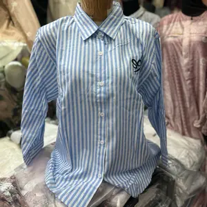 Meizza.id Kemeja Katun Premium dengan Desain Garis Biru Putih dan Logo Hitam untuk Tampilan Elegan