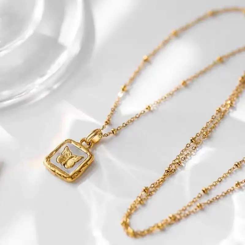 Stainless steel necklace as jewelry grade with 18K gold, adorned with an elegant gold square pendant,which with a beautiful butterfly in the center, making it be a beautiful and elegant fashion piece for women and girls.