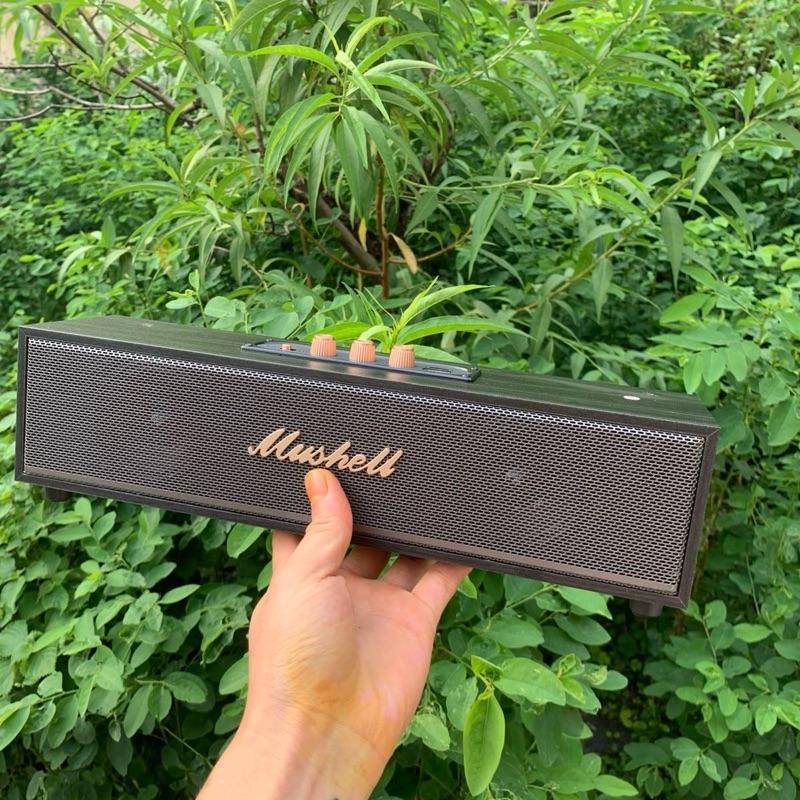 Mushell Loa Bluetooth 1997 XM-303 20W Hộp Chữ Nhật Dài Vỏ Giả Vân Gỗ Màu Đen Kim Loại Màu Đồng Logo Chính Giữa Hỗ Trợ Bluetooth USB Pin Hơn 4 Giờ