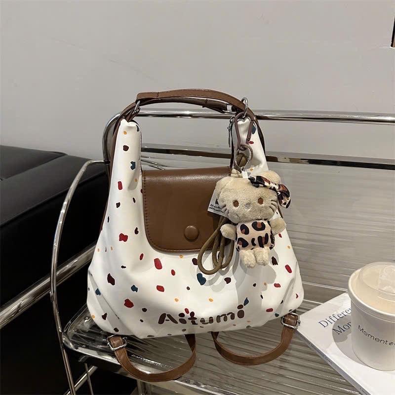 Túi xách nữ dáng balo hoạ tiết chấm bi tặng kèm charm khỉ xinh AMITU