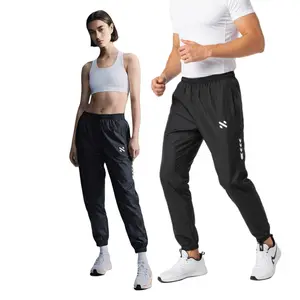 NEBULA Celana Panjang Jogger Bahan Parasut Pria Wanita Olahraga Running Gym Sport Desain Nyaman Kantong Resleting Pelindung Sinar UV Ukuran M-XXXL