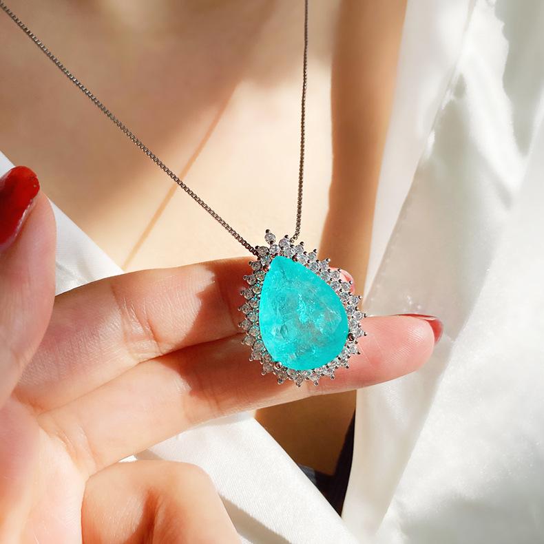 Product Introduction of Micro Inlaid Paraiba Water Drop Gem Necklace Female Ocean Heart Pendant Long Sweater Chain Female 10
