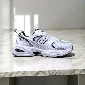 promo sepatu sneakers pria wanita nbe model 530 putih silver hitam nyaman untuk olahraga dan sehari hari