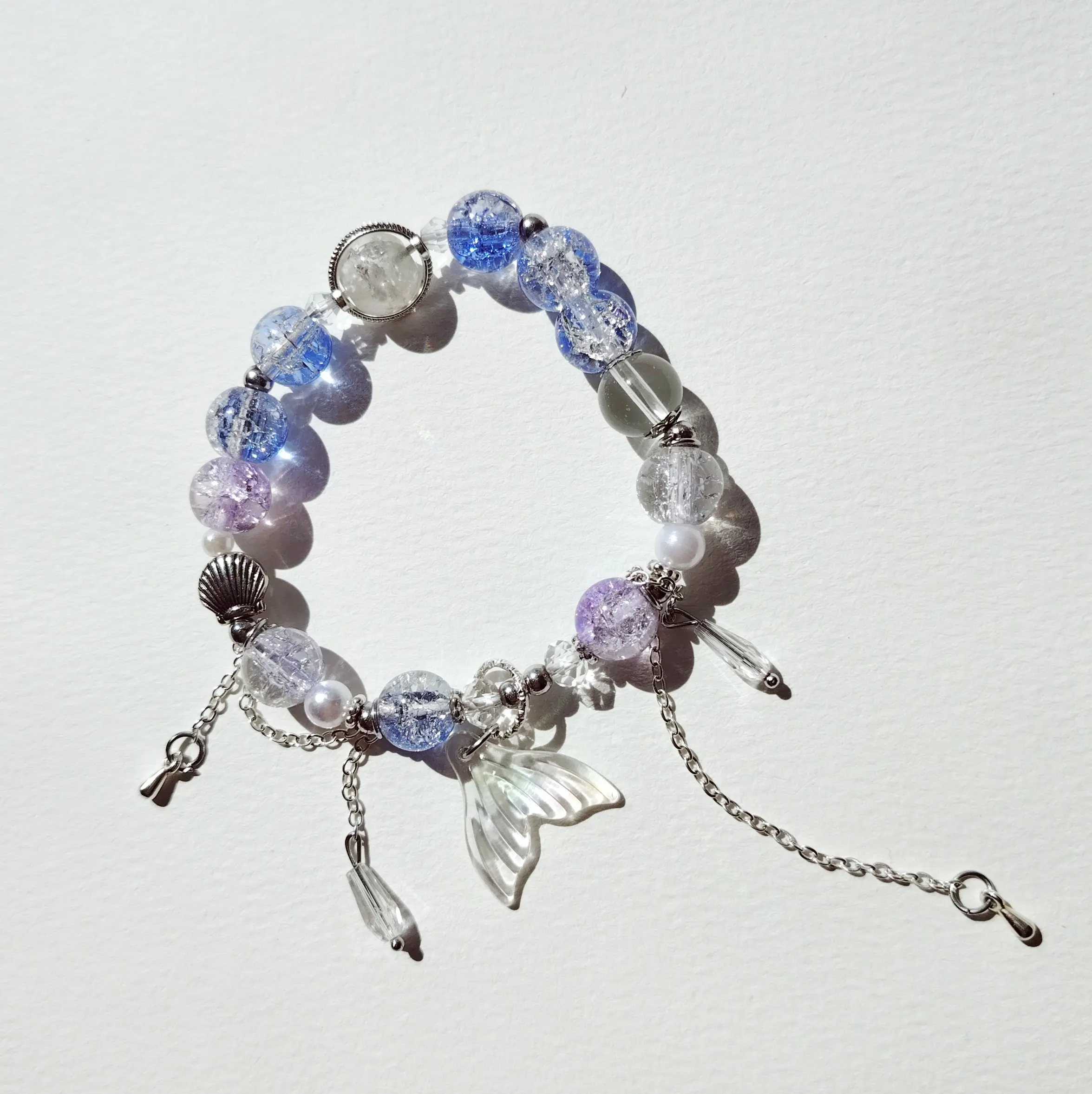 Women's bracelet featuring mermaid tail and butterfly design, elegant, simple, and luxurious.