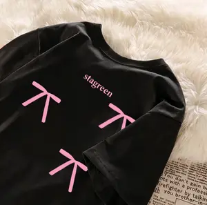 Cute Pink Bow Graphic Oversized White/Black T-Shirt: Stylish Loose-Fit Crew Neck Top for Women’s Casual Daily Wear