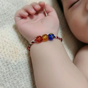Gelang bayi tridatu simbol keberuntungan