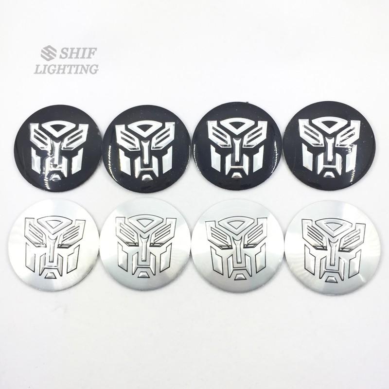 4 cái nắp trung tâm đùm bánh xe 56 mm với logo Transformers Autobots, miếng dán…
