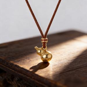 Adjustable modern Chinese style collarbone necklace with a copper Hu Lu pendant and red string | Chinese inspired jewelry symbolizes luck and prosperity