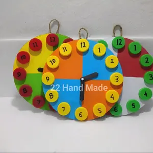 Prakarya Jam dinding dari kertas warna dan tutup botol