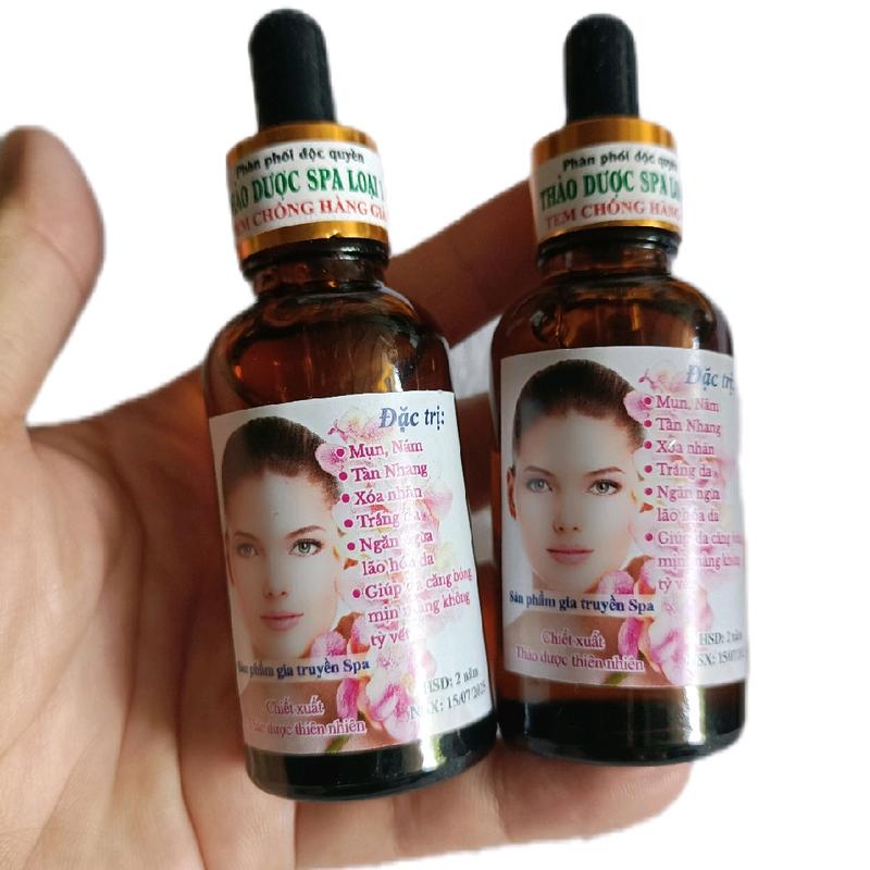 2 lọ nước tái tạo da spa. nắp đen ư trị mụn thâm nám tàn nhang