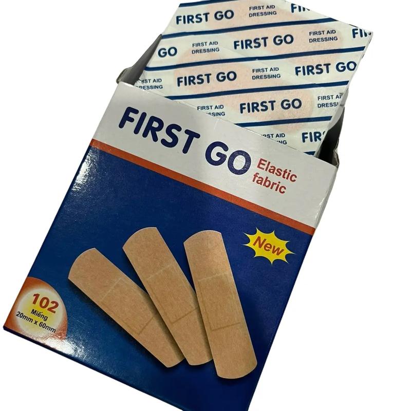  First Go Băng Cá Nhân Vải - Hộp 100 Miếng Độ Dính Cao Vải Mềm Mại Không Kích Ứng Da Bảo Vệ Vết Thương Tiện Lợi 