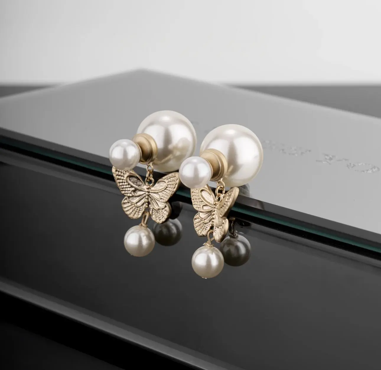 Ethereal Pearl Butterfly Stud Earrings | Hollow-Out Tassel Design, Trending Luxury Jewelry for Singapore’s Fashion-Forward