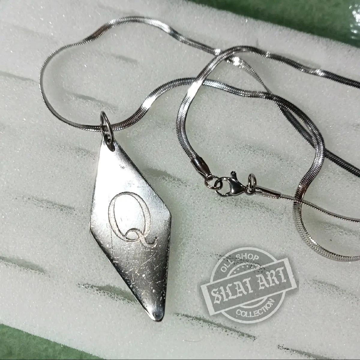 Kalung Titanium IKS PI ''Q"