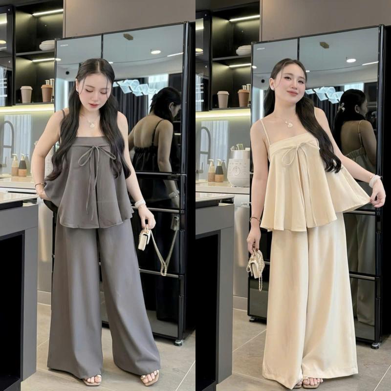  Set đồ nữ tuyết áo 2 dây có tăng đơ cổ vuông cột nơ trước kèm quần suông ống rộng dáng dài xinh xắn dành cho các nàng diện đi chơi đi tiệc. 