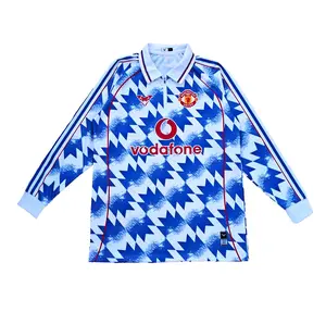 JERSI EMYU MANCHESTER UNITED PUTIH BIRU MOTIF TANGAN PANJANG DENGAN SLETING