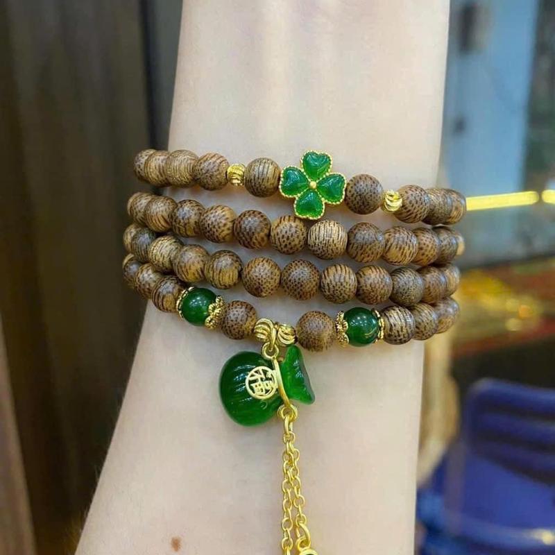 Vòng Tay Trầm Hương 108 Hạt Mix Charm Cỏ Bốn Lá May Mắn Và Túi Tiền Kim Bảo