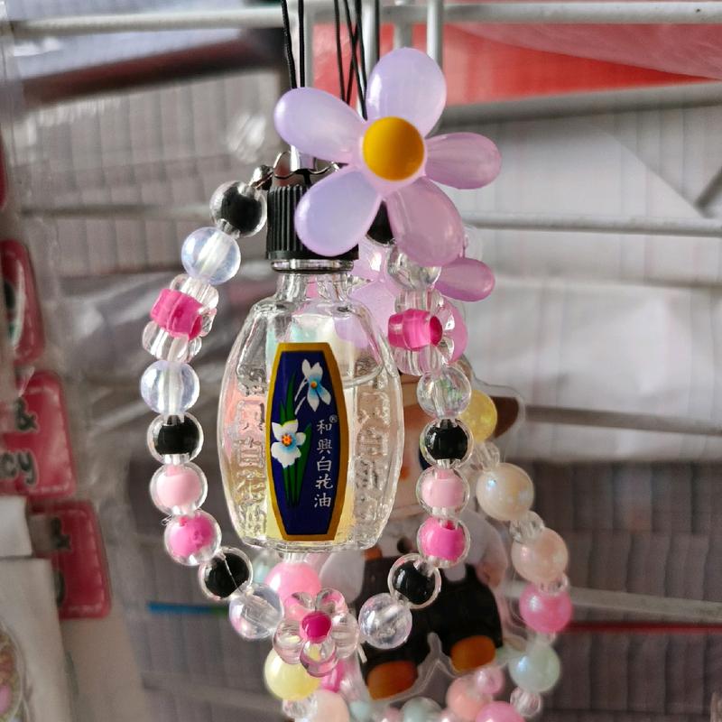 White Flower Oil Keychain - TikTok Shop Philippines