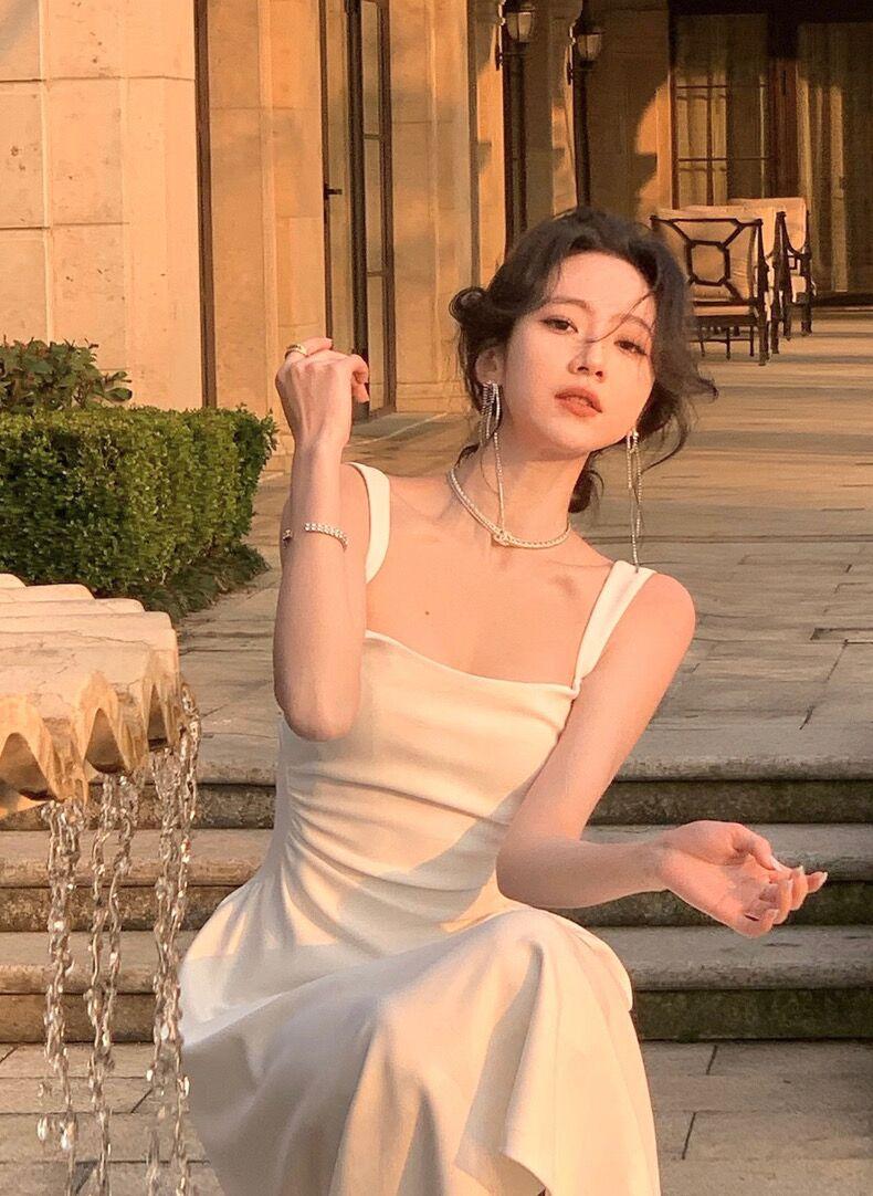 Product Introduction of Women's new slim fit mid length dress, solid color suspender dress, waist cinching, niche design for girls, women's mid length dress Casual Womenswear 23
