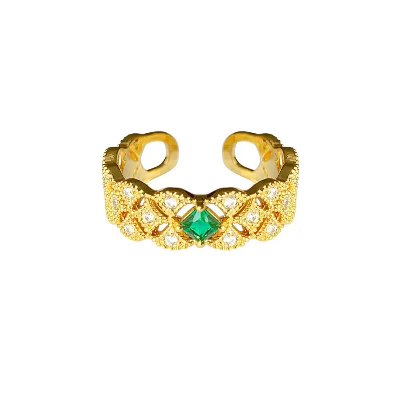 Emerald gemstone hollowed-out diamond-studded ring.